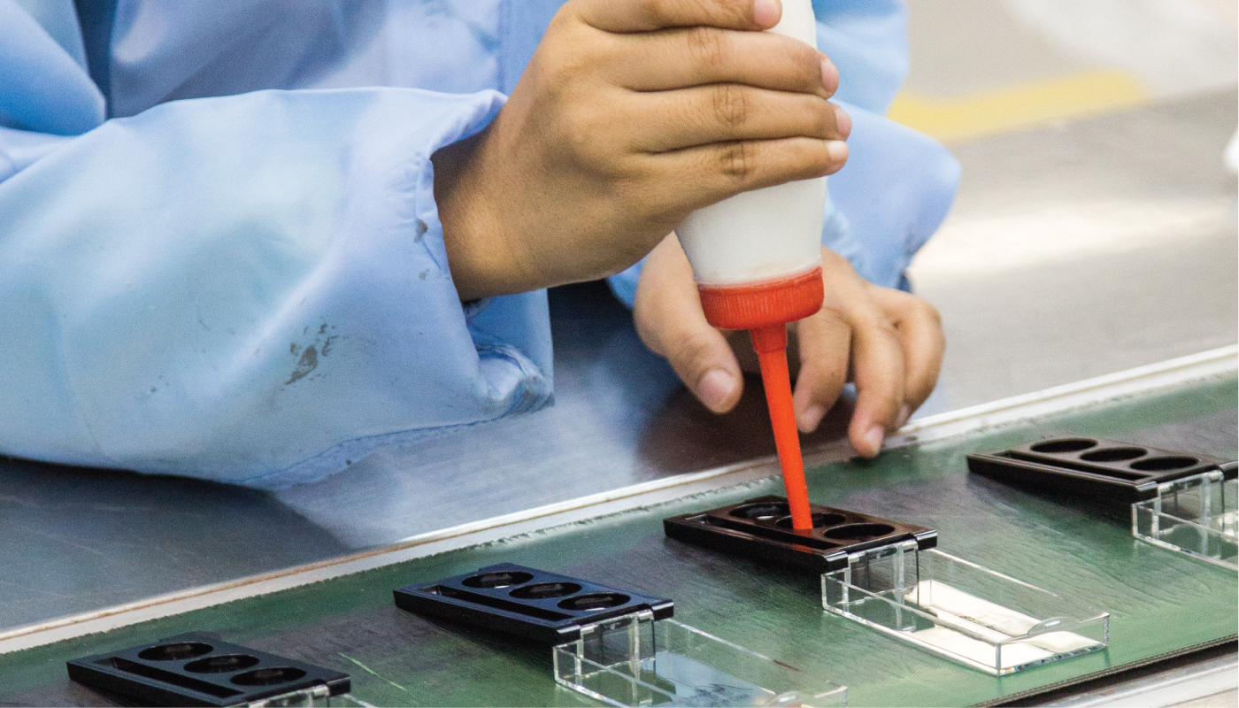 Cosmetic compact pressing and automated packaging assembly line